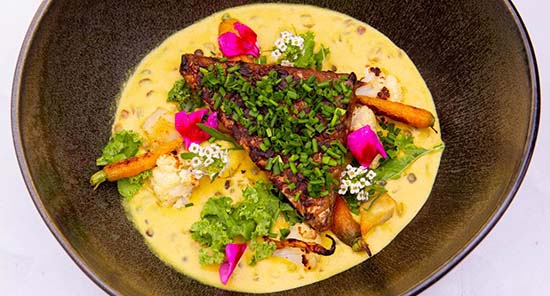 Tempeh curry main all organic and healthy gut-friendly protein at PLANT Miami, sustainable farm to table plant-based restaurant