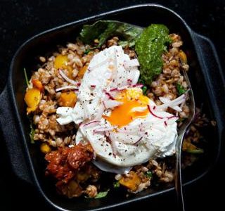 Specialty breakfast harvest bowl with local pastured egg and ingredients from MN family farmers at Farmers Kitchen & Bar, Minneapolis