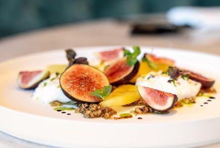 Beautiful cheese and fruit plate at healthy indulgent restaurant Le Jardinier, Houston